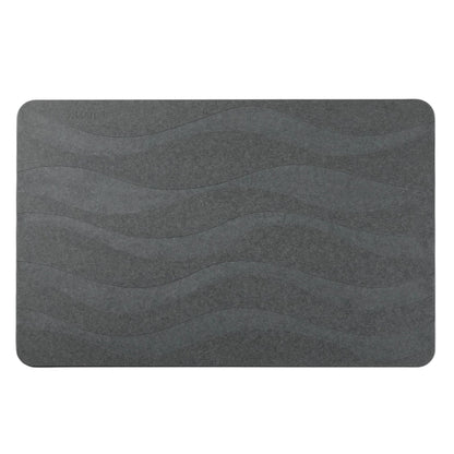 Dark gray stone bath mat with wave texture.