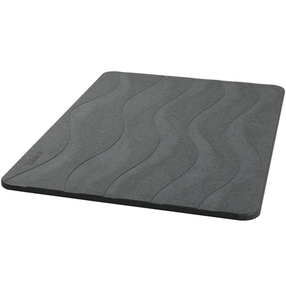 Gray stone bath mat with wave pattern