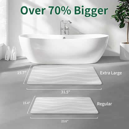 Stone bath mat comparison with 'Extra Large' and 'Regular' sizes shown in a bathroom setting.
