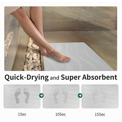 Person stepping onto a quick-drying and super absorbent mat in a bathroom setting.