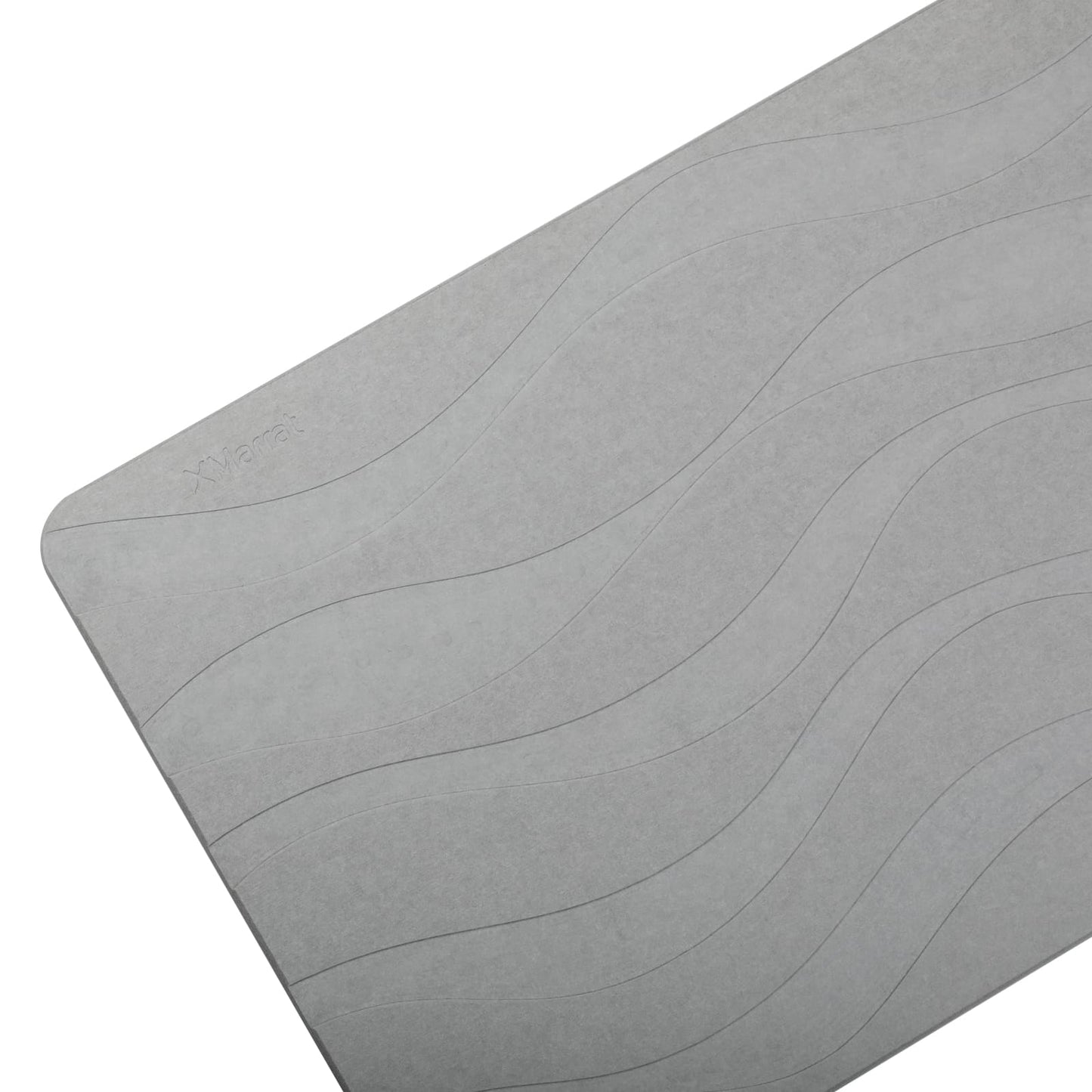 Gray stone bath mat with wave pattern