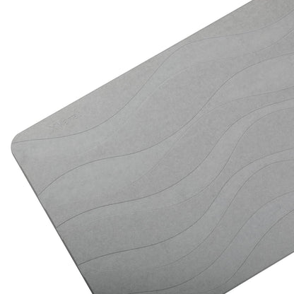 Gray stone bath mat with wave pattern